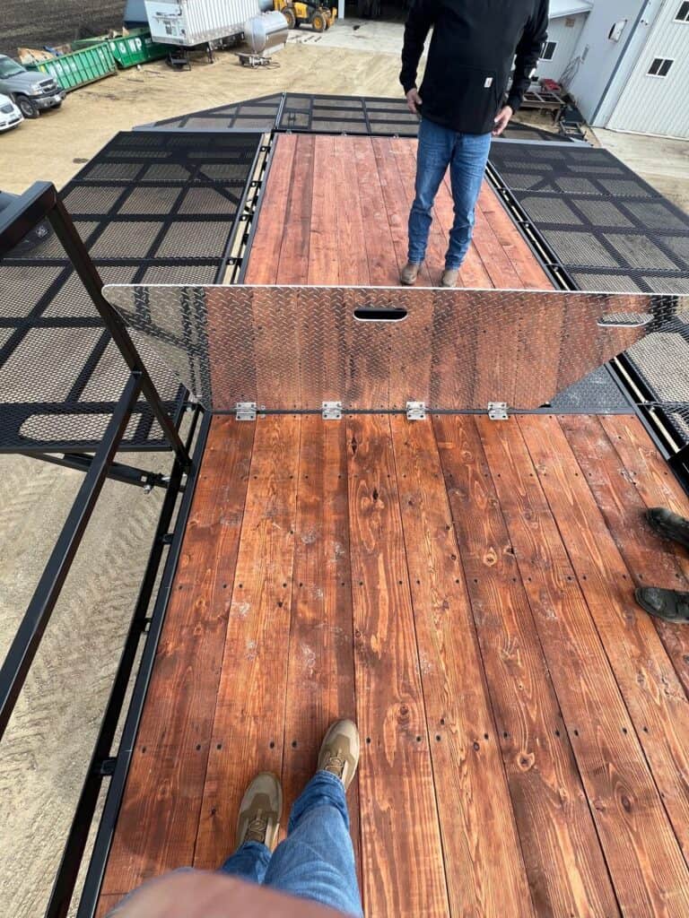 Operator standing on ECHO SS Drone Skid platform deck mounted on semi truck for agricultural drone support