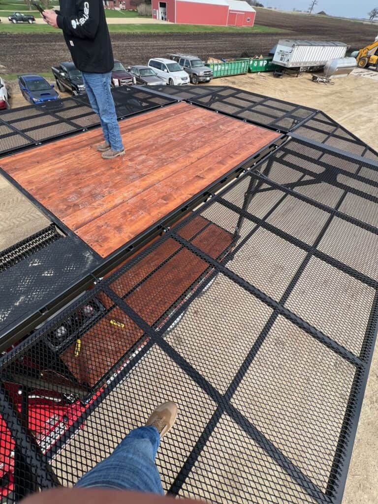 Operator standing on ECHO SS Drone Skid elevated platform deck for agricultural drone operations