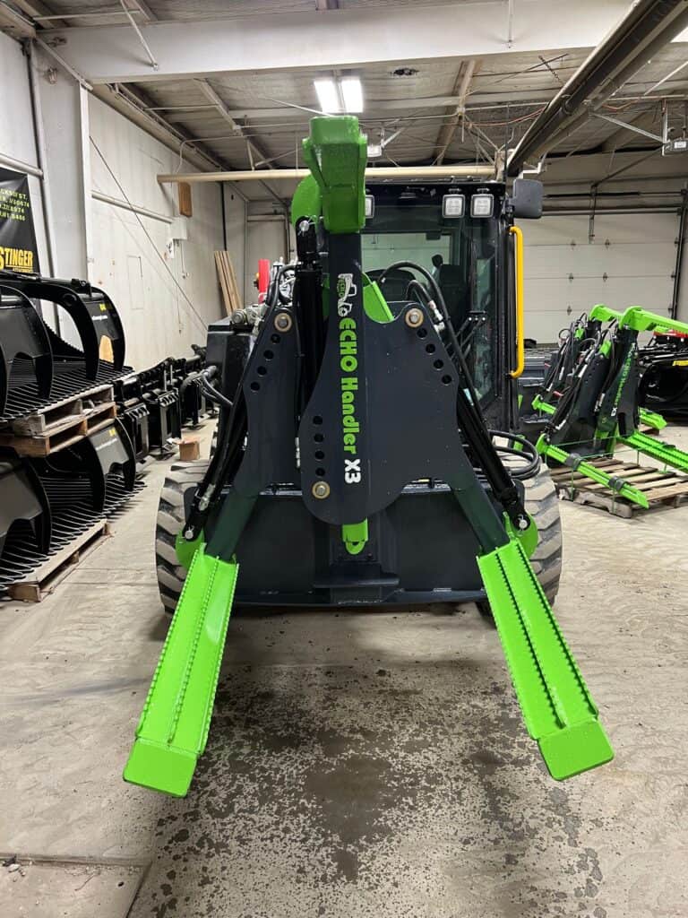 Close up heavy duty skid steer tire grabber frame and hydraulic positioning arms