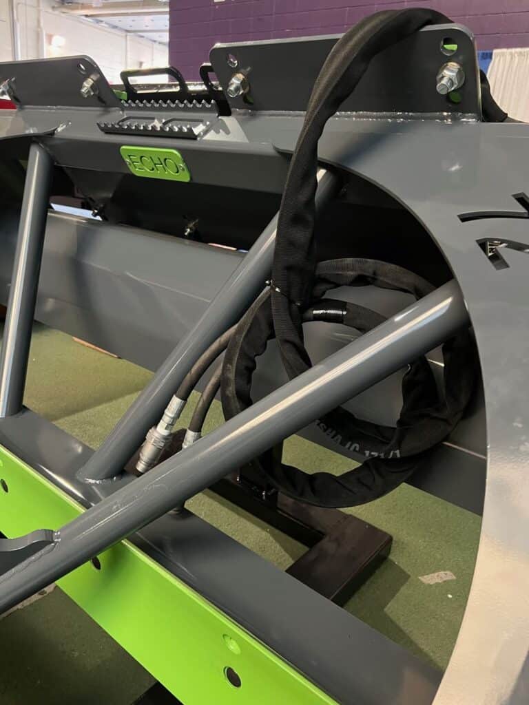 Rear view hydraulic system and frame on ECHO PG3 skid steer power grader attachment