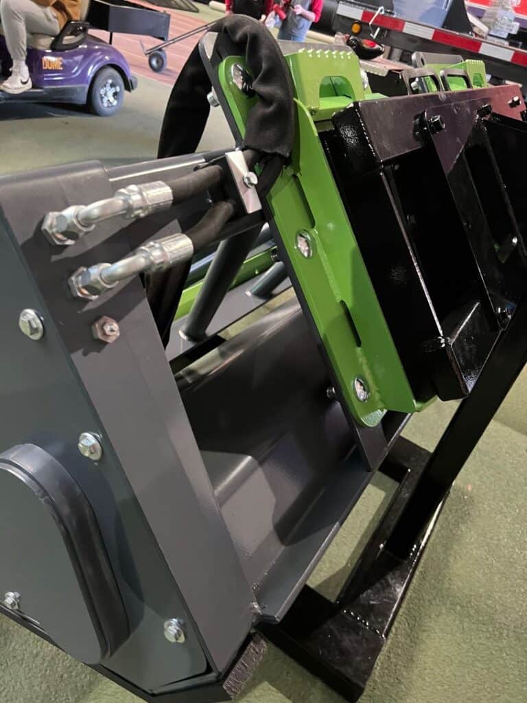 Hydraulic hose routing and cylinder mounts on ECHO PG3 skid steer power grader