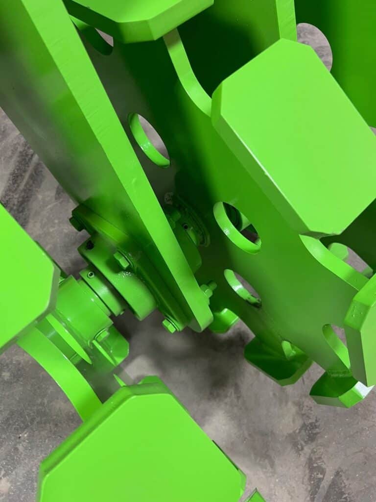 Close up of ECHO SSCW skid steer compaction wheel steel frame and reinforced mounting bracket assembly
