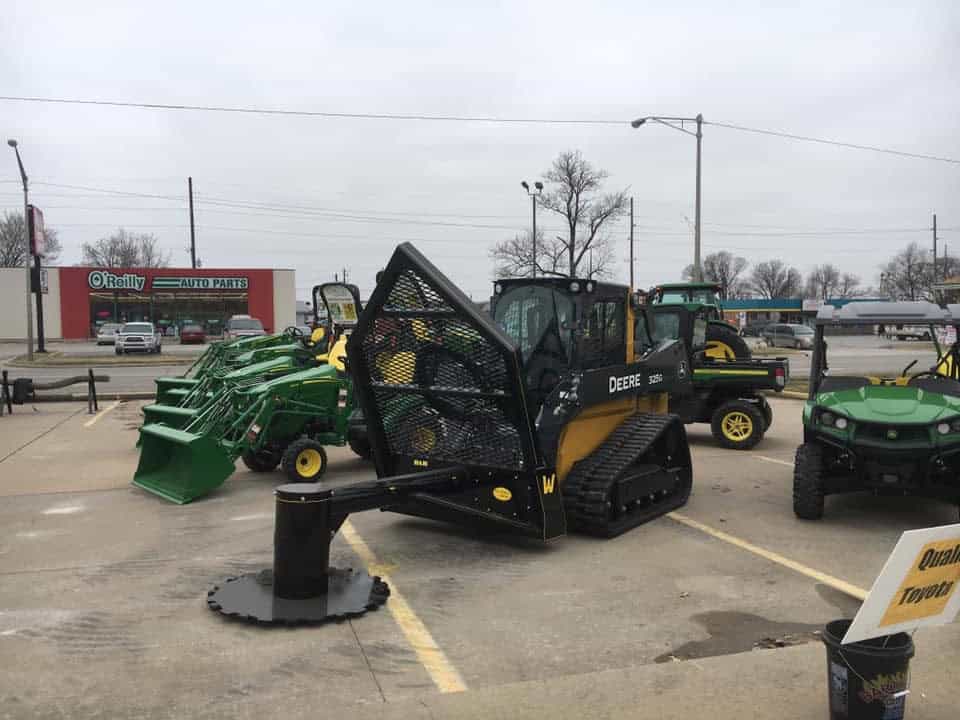 M&M Hydra Saw skid steer attachment displayed on John Deere compact track loader