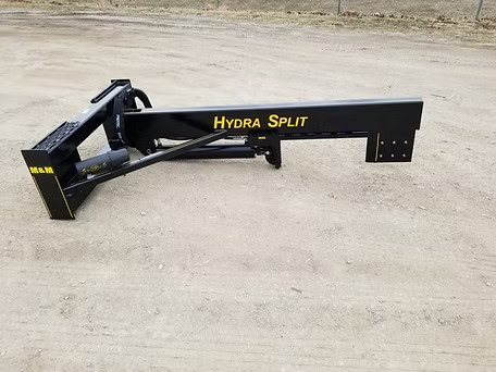 Right side view of M&M Hydra Split skid steer log splitter attachment on gravel lot