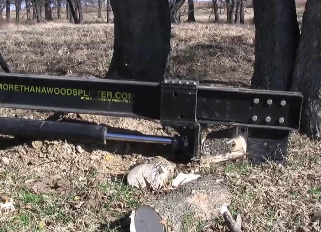 Close up of splitting wedge on M&M Hydra Split skid steer hydraulic log splitter
