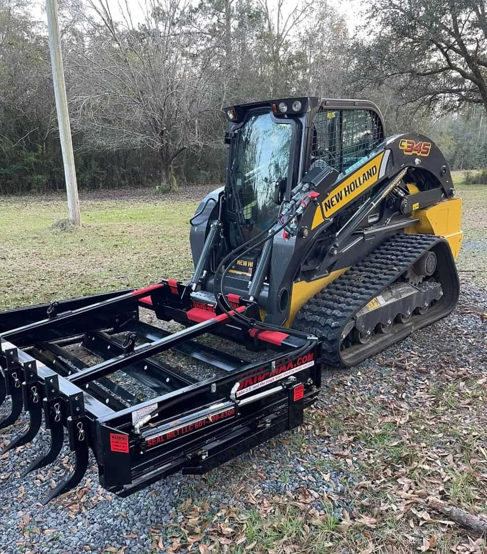 Skid Max 3 blade hydraulic skid steer grader mounted on New Holland C345 loader