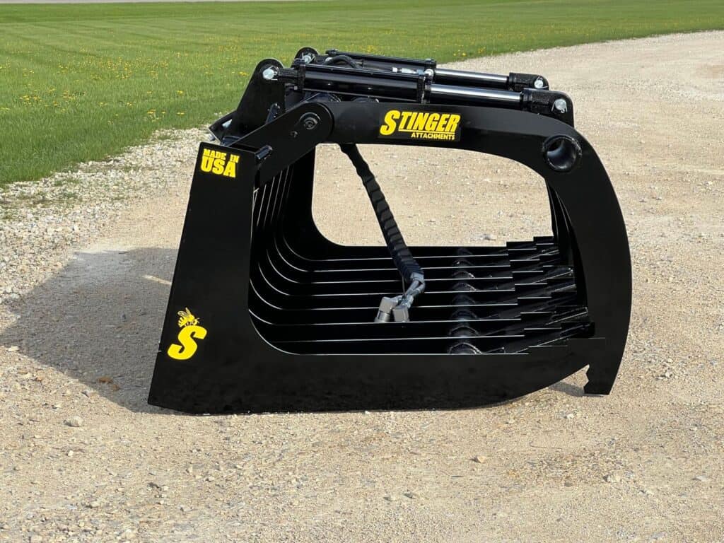 Stinger RTG grapple right side view showing grapple arm shape and structural frame design