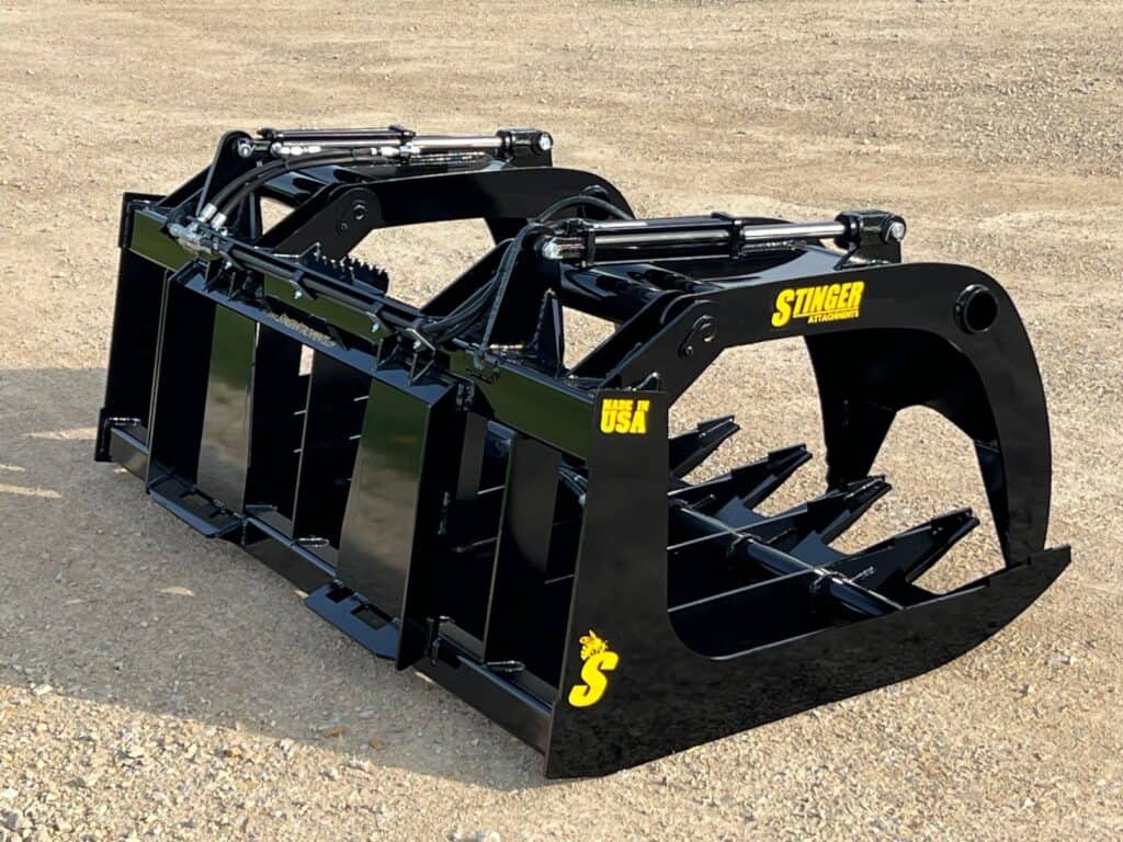 Stinger RTG grapple rear angle showing side plate reinforcement and tine layout for durability