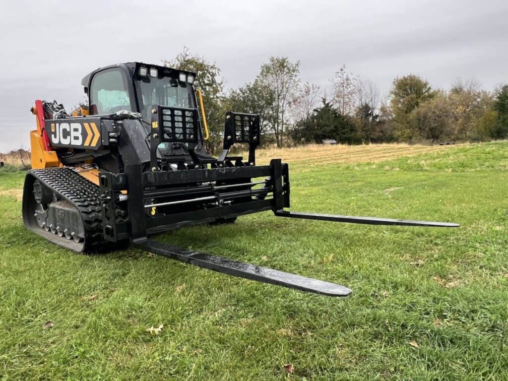 Stinger PF3H 72 inch hydraulic pallet forks mounted on JCB compact track loader