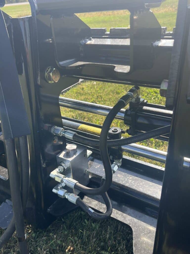 Close up of sliding fork carriage and guide system on Stinger PF3H pallet forks