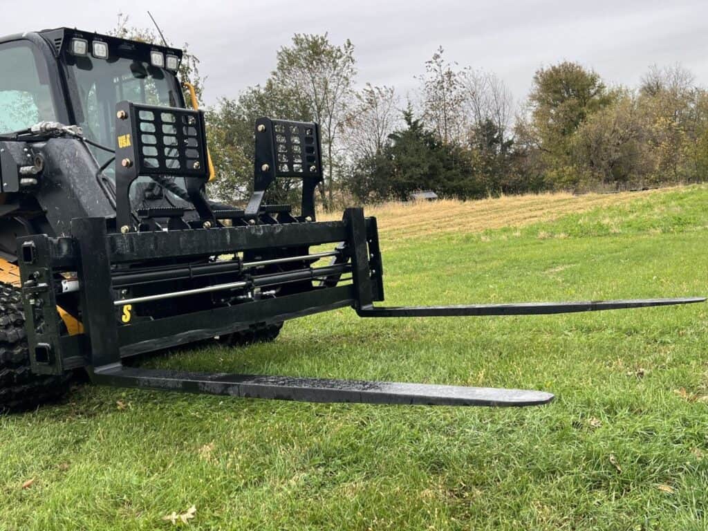 Close up of Stinger PF3H hydraulic pallet forks mounted on JCB teleskid loader