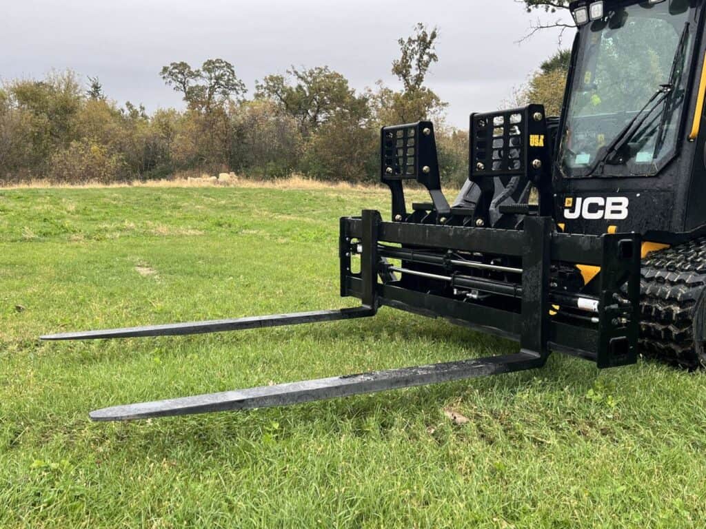 Front view of Stinger PF3H hydraulic pallet forks mounted on JCB compact loader