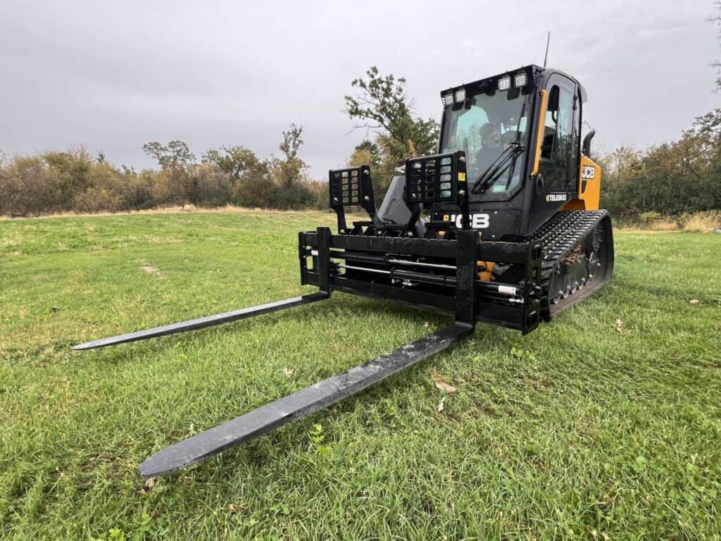 Stinger PF3H 72 inch hydraulic pallet forks mounted on JCB compact track loader