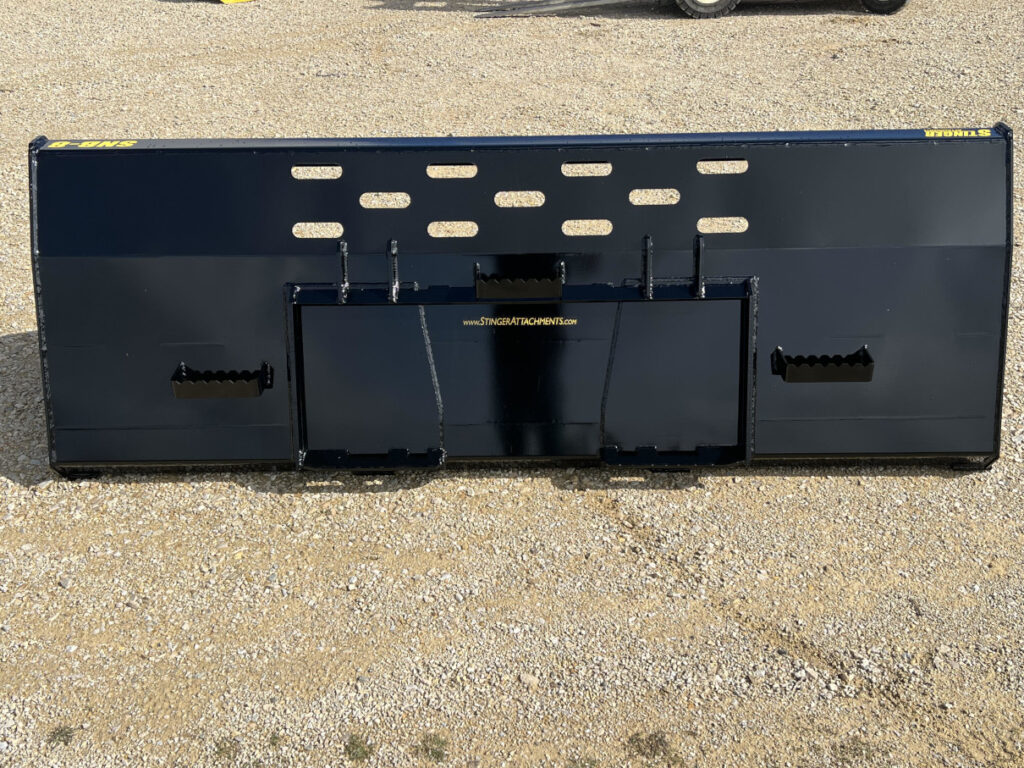 Straight rear view of Stinger SNB skid steer snow bucket showing quick attach plate, steps, and rear visibility slots