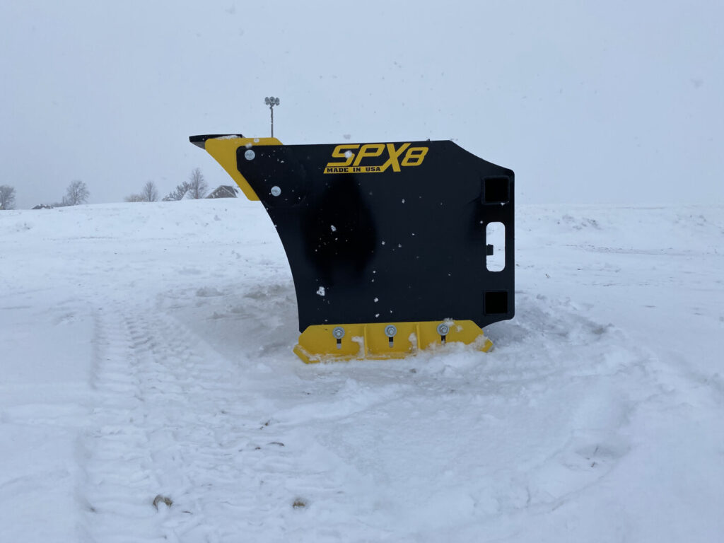 Stinger SPX8 snow pusher side profile showing reinforced end plate and replaceable wear edge