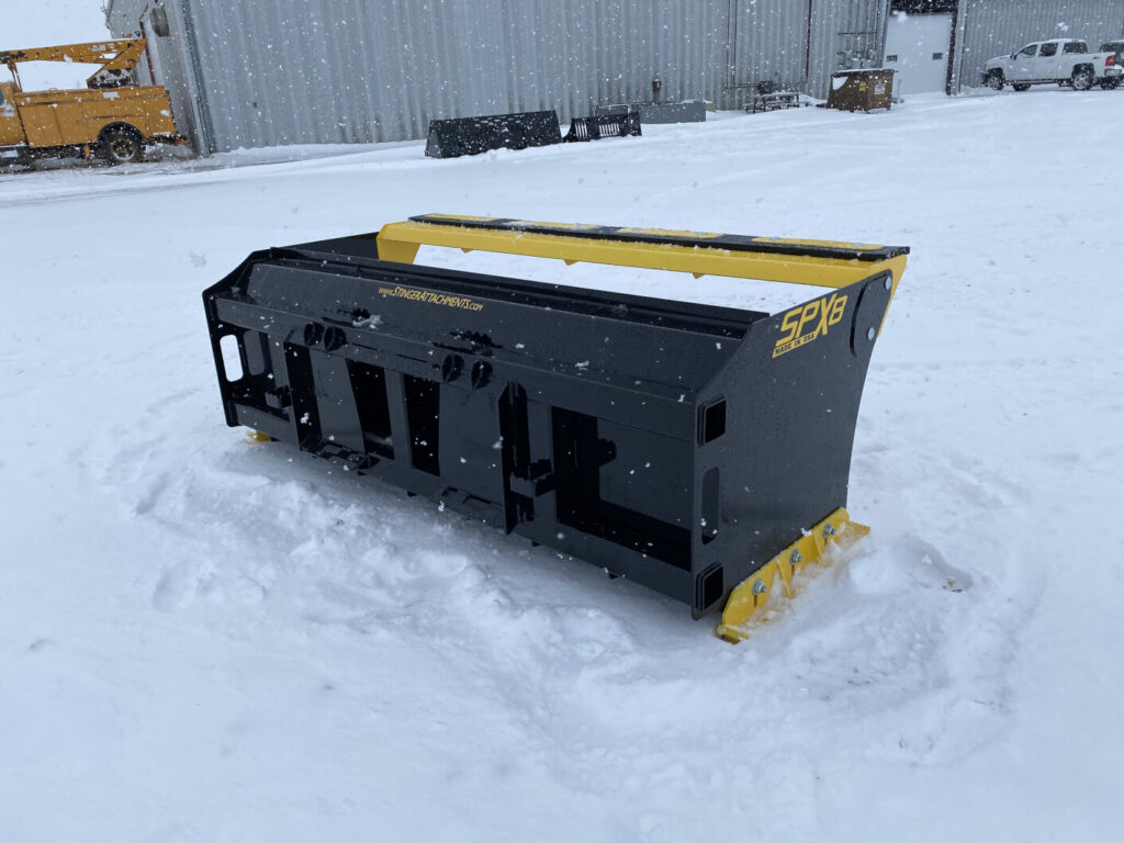 Rear three-quarter view of Stinger SPX8 snow pusher showing attachment mount and reinforced frame