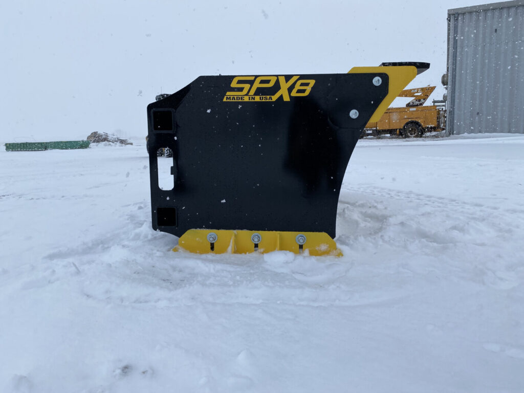 Stinger SPX8 snow pusher side view showing deep box design and replaceable lower cutting edge