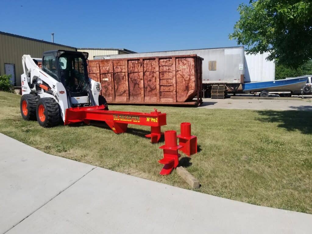 TM Manufacturing Pro 2 36 inch skid steer log splitter with wedge attachment installed