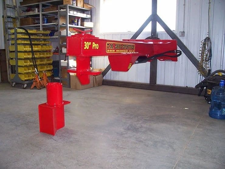 TM Manufacturing Pro 2 skid steer log splitter attachment mounted for storage display