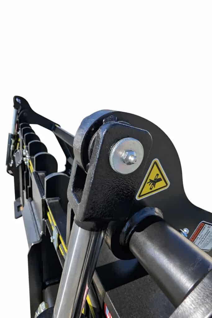 Close-up of the ANBO GR140HC grapple rake hydraulic cylinder pivot, pin and reinforced grapple arm connection