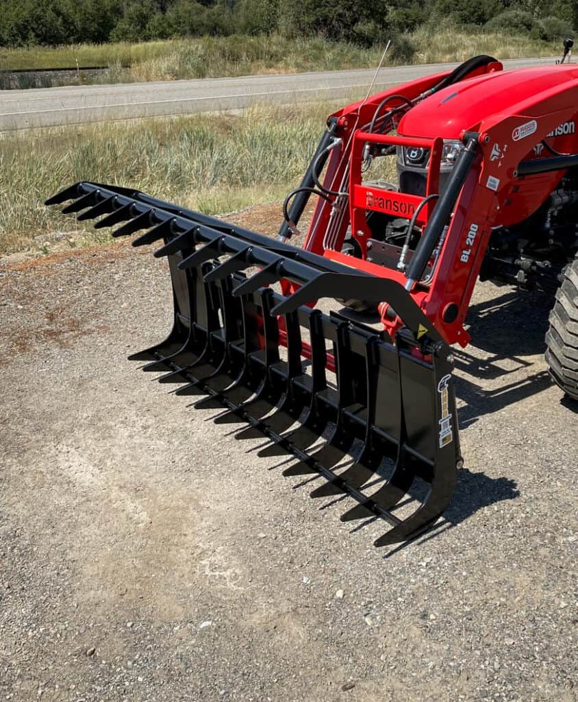 ANBO GR45 grapple rake fully open on a Branson tractor showing the upper and lower AR400F grapple tines