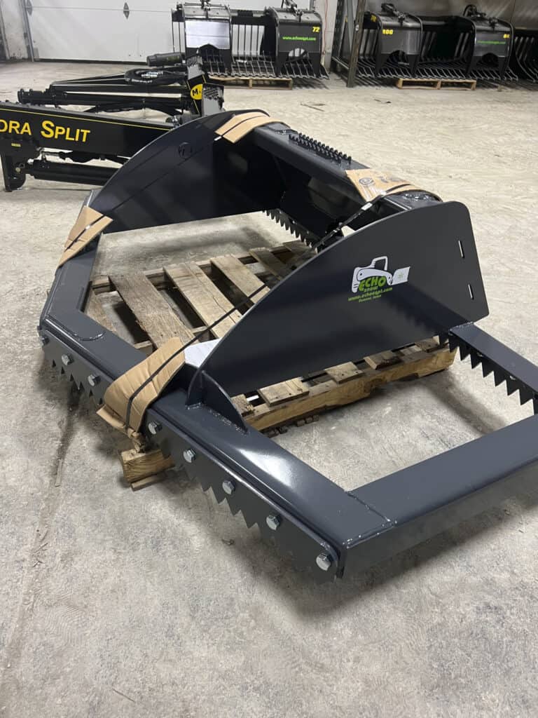 ECHO 86 inch skid steer ice scraper and scarifier in the shop showing the heavy steel frame and replaceable serrated blades