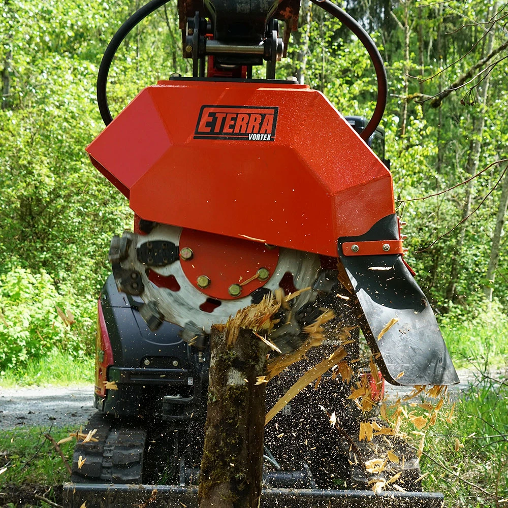 Eterra Vortex stump grinder cutting through a tree stump and throwing wood chips