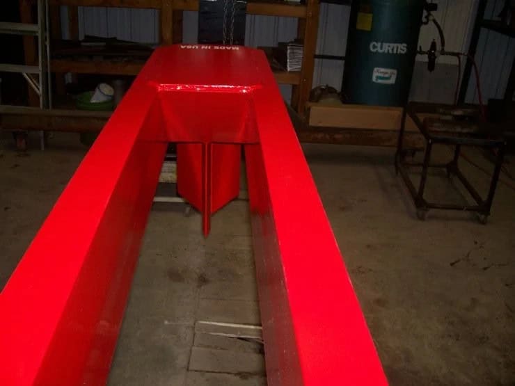 Close-up top view of the TM Manufacturing Pro 1 skid steer log splitter fixed wedge and beam