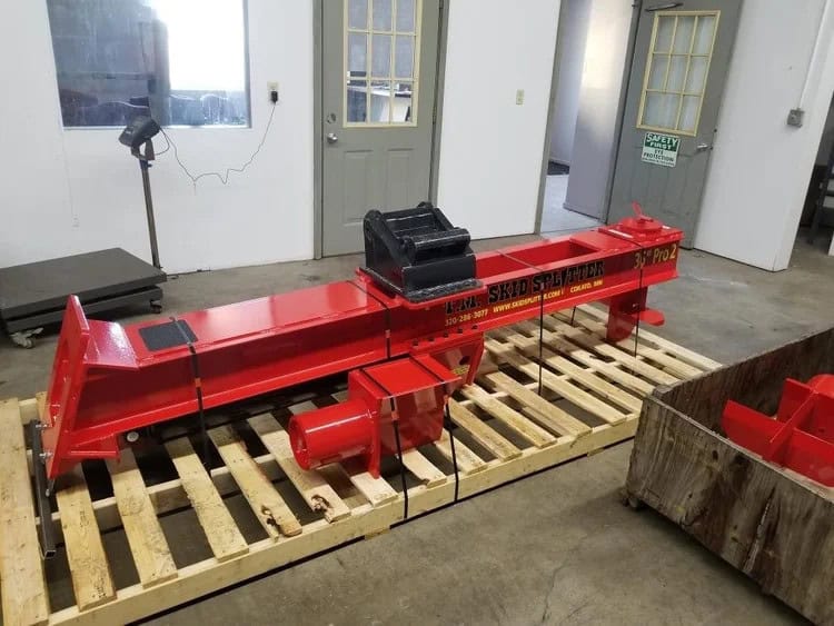 TM Manufacturing Pro 2 30 inch excavator log splitter on a pallet with excavator coupler mount installed
