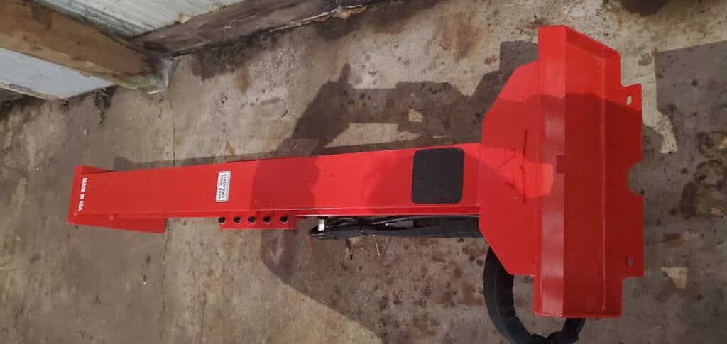 Top view of the TM Manufacturing Warrior 24 inch skid steer log splitter showing beam, hoses and attachment mount