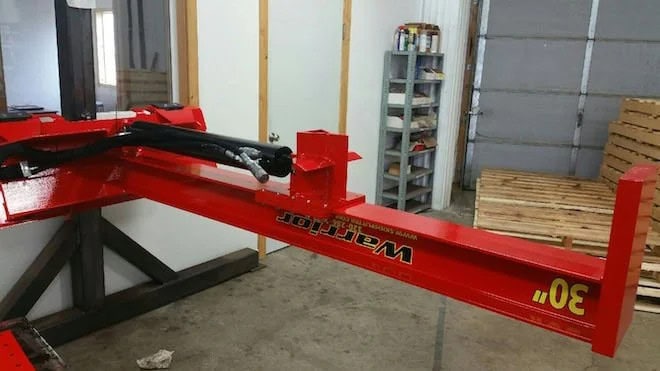 TM Manufacturing Warrior 30 inch skid steer log splitter showing the hydraulic cylinder, hoses and heavy steel beam