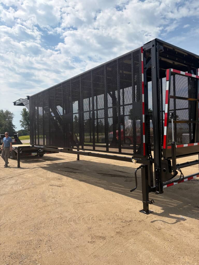 Full side view of the ECHO SS Drone Dock showing the long enclosed mesh panel body and elevated upper work platform