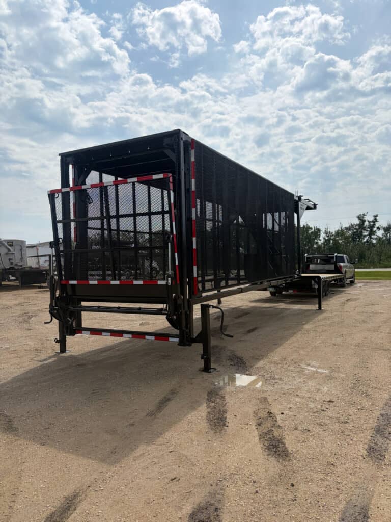 Rear angle view of the ECHO SS Drone Dock with enclosed mesh rear gate, support jacks and elevated trailer platform