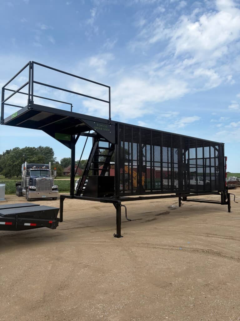 ECHO SS Drone Dock removable trailer platform shown from the side with elevated upper deck and enclosed mesh lower section