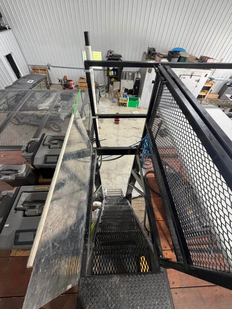 ECHO SS Drone Dock stair access area showing the expanded metal steps, upper platform and mesh safety gate