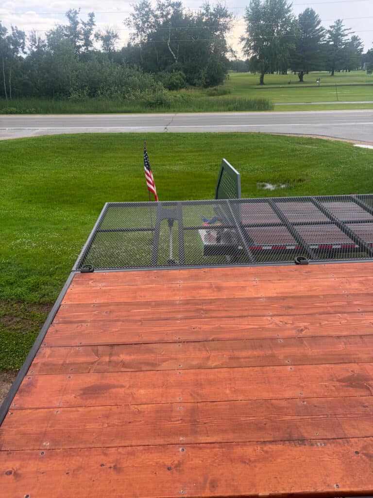 View across the ECHO SS Drone Dock wood deck showing the expanded mesh wing platform and surrounding work area
