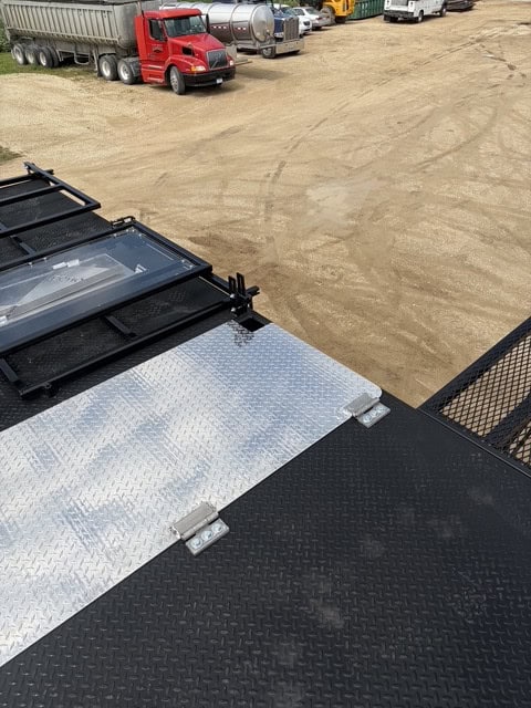ECHO SS Drone Dock upper trailer deck showing the hinged diamond plate access hatch and folded shield assembly