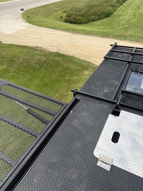 ECHO SS Drone Dock upper platform showing the deck surface, expanded mesh side wing and diamond plate access hatch