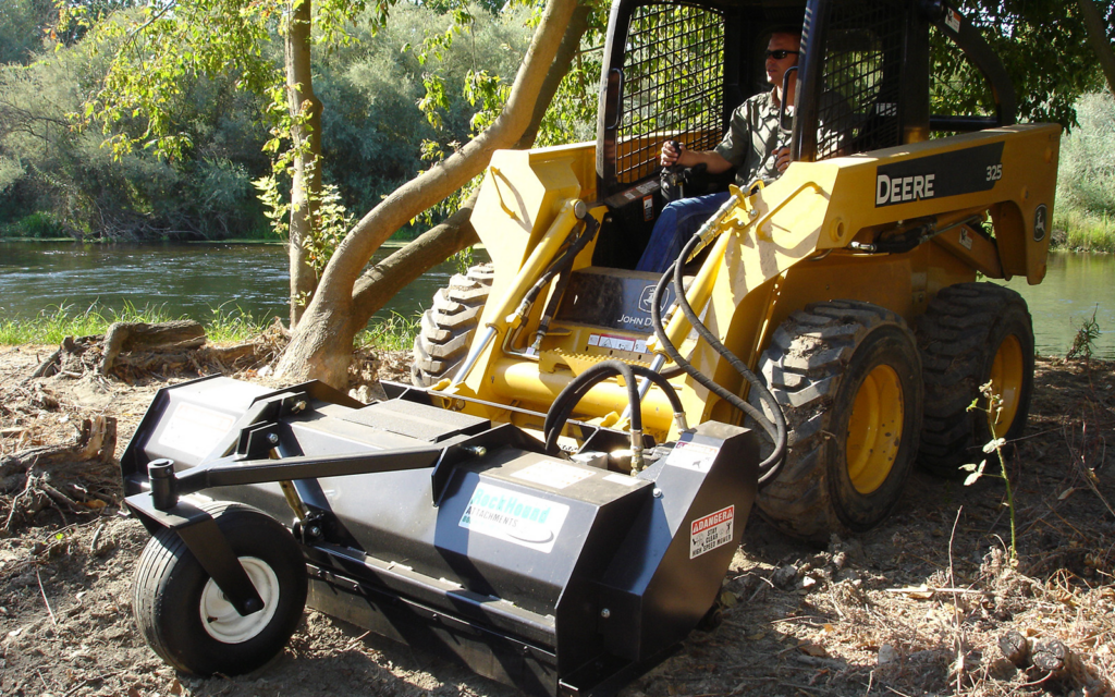 BrushHound 72F Skid Steer Flail Mower mounted on a John Deere skid steer for grass and light brush maintenance.
