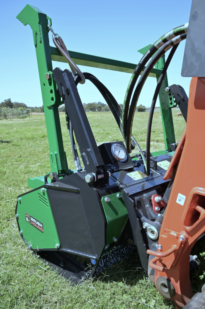 Front view of the BrushHound FHX66 Defender showing the cutter drum, knives, and adjustable tree bumper.