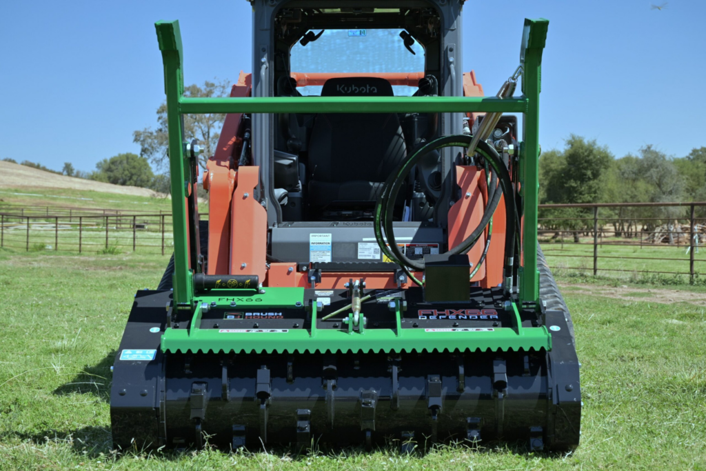BrushHound FHX66 Defender Skid Steer Forestry Mulcher mounted on a skid steer with the cutter drum facing forward.