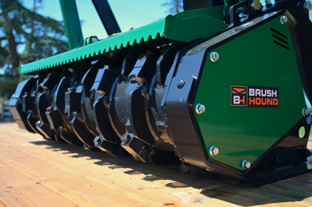 Close-up of the BrushHound FHX66 Defender cutter drum and Quadco forestry mulching knives.