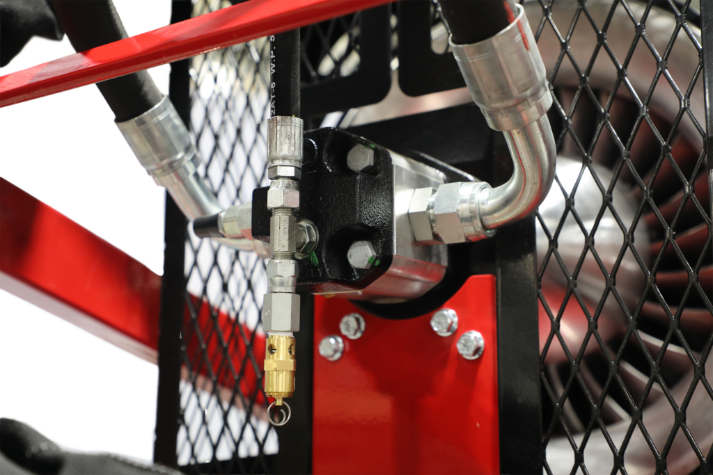 Close-up of the Buffalo Turbine Cyclone Hydraulic debris blower hydraulic motor, manifold, and fittings