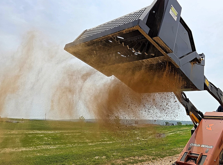 Ideal Rockaway 4415 mini skid steer landscape rake screening soil and removing rocks