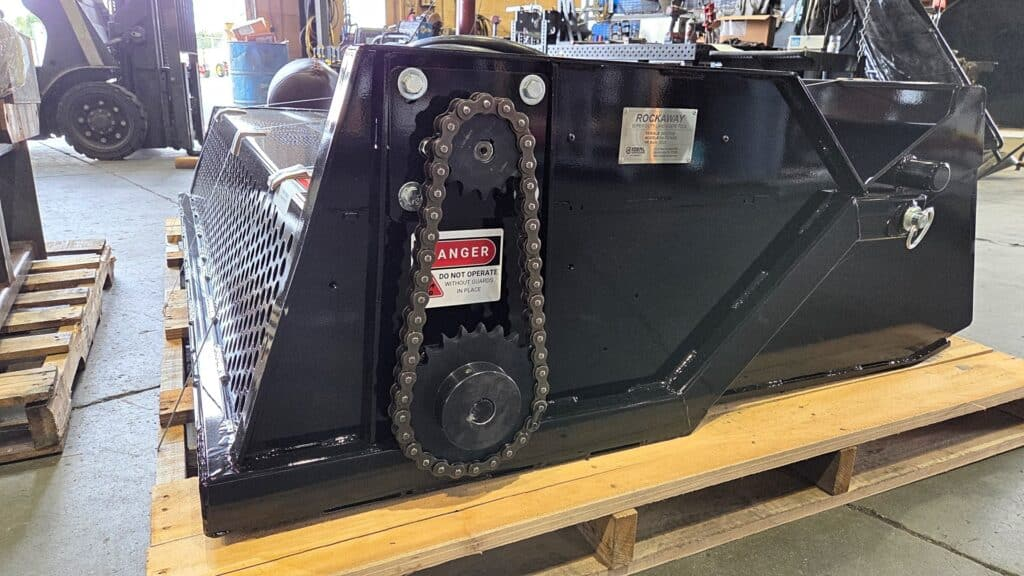 Ideal Rockaway 8415 skid steer rock rake showing the protected #80 chain drive