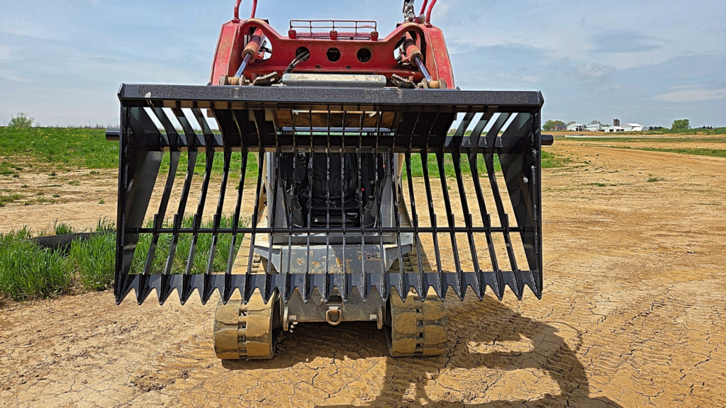 Ideal Rockaway skid steer rock bucket showing open tine spacing for separating rocks from soil