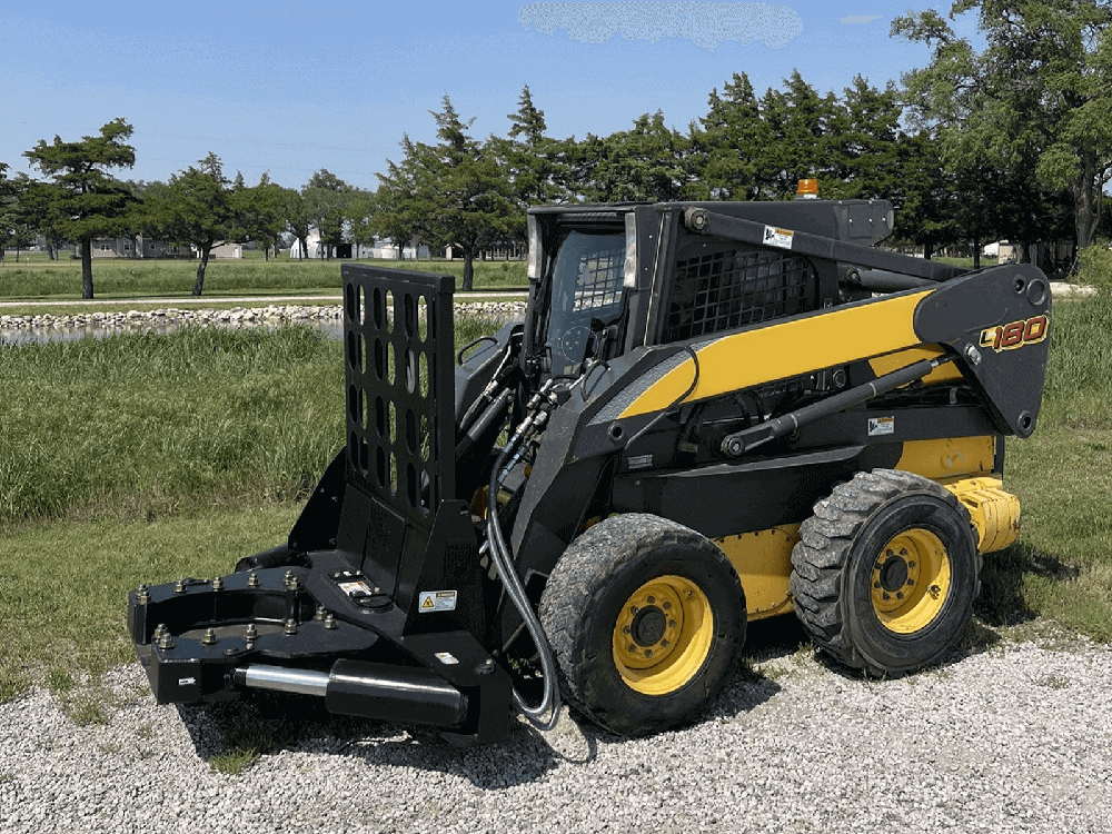Maxx Attachments 20-inch Ranch Axe tree shear mounted on a skid steer for land clearing