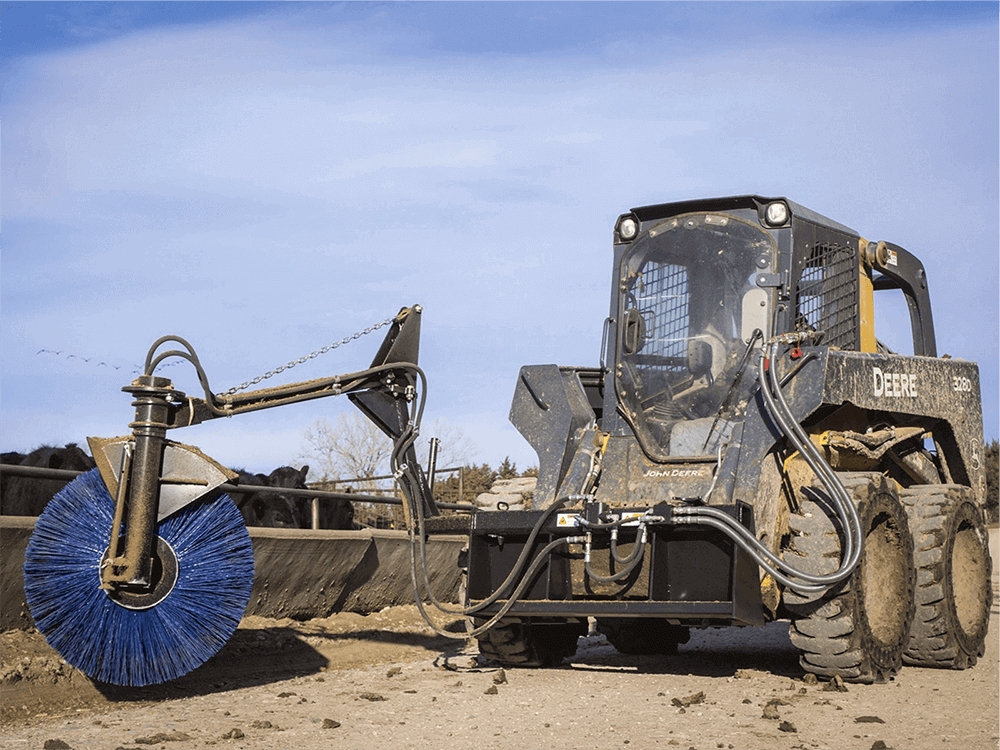 Maxx Attachments Feed Bunk Sweeper mounted on a John Deere skid steer