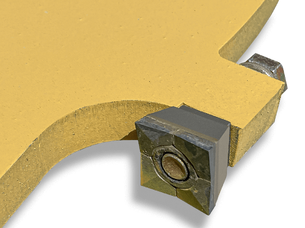 Close-up of a replaceable carbide cutting tooth bolted to the Maxx Attachments XD skid steer tree saw disc