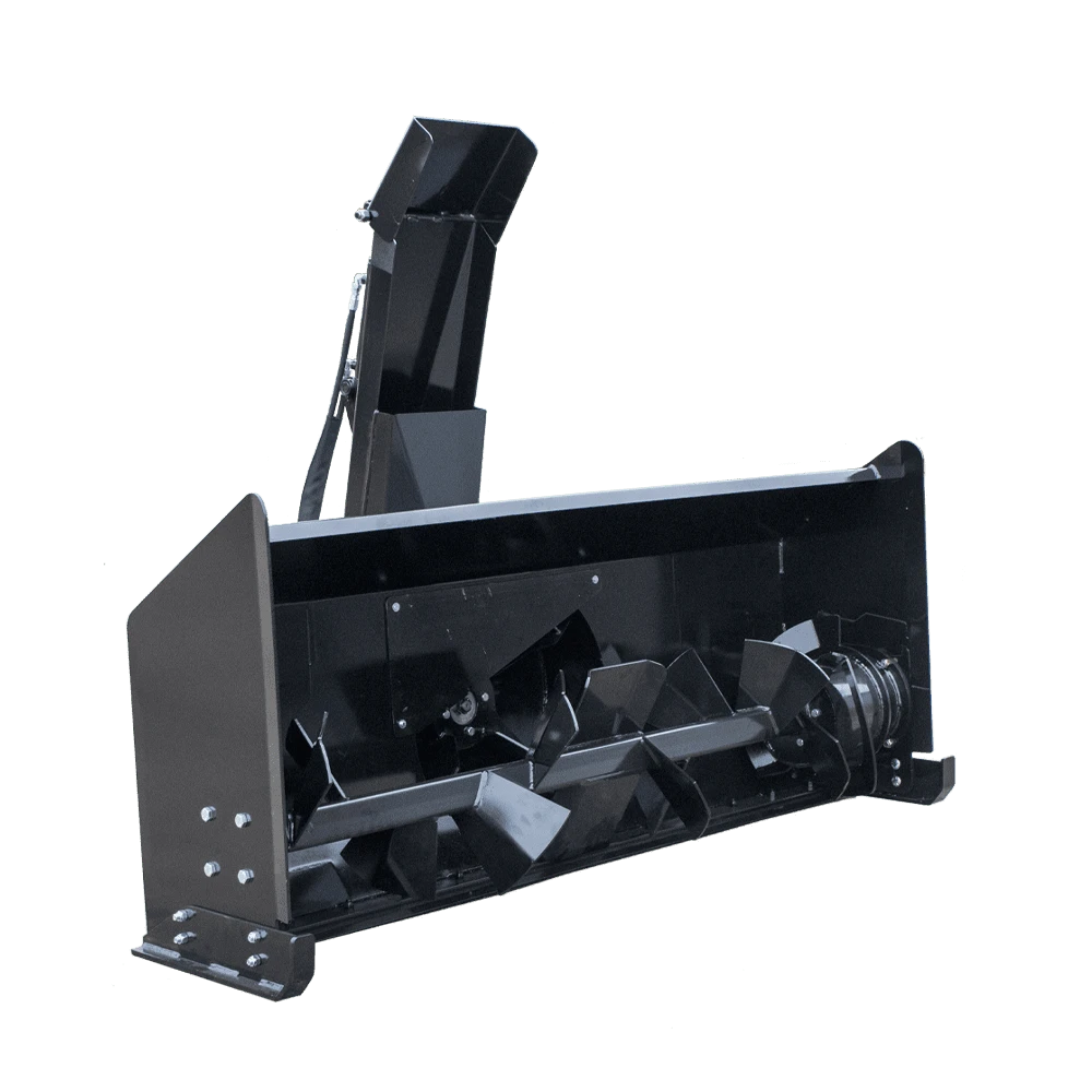 Angled front view of Prime Attachments Skid Steer Snow Blower showing auger paddles, fan housing, chute, and cutting edge
